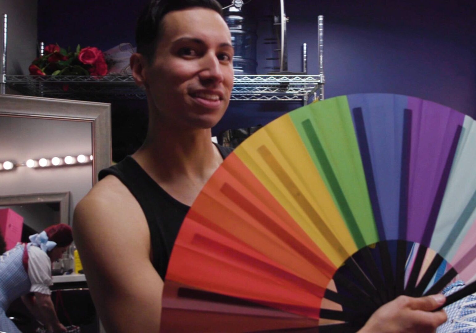 Person with rainbow fan