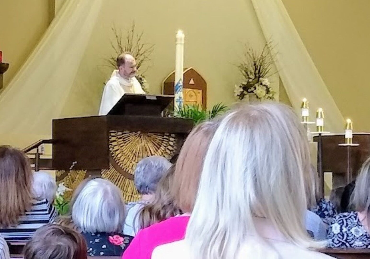 Fr. Justin Hoye presides at the altar of St. Thomas More Catholic Church at this year’s Easter Vigil service.