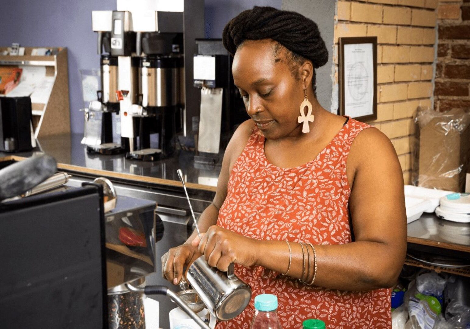 Nika Cotton makes a drink at Soulcentricitea, which she opened on Troost Ave. last July. Cotton applied for a grant from the Restaurant Revitalization Fund, but did not receive any money.