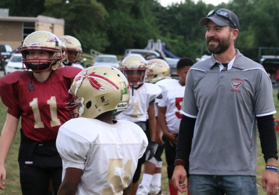 Nick Sanford with his youth football players