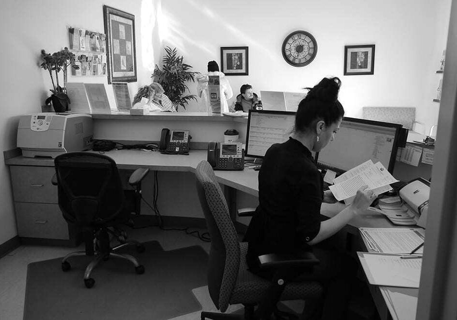 As clients waited to be seen, patient-care representative, Jiyan Muhamad, worked the front desk Monday at the Northland clinic of the Samuel U. Rodgers Health Center. The health center is hoping to occupy expanded space in a health-transit hub under discussion for the Northland.