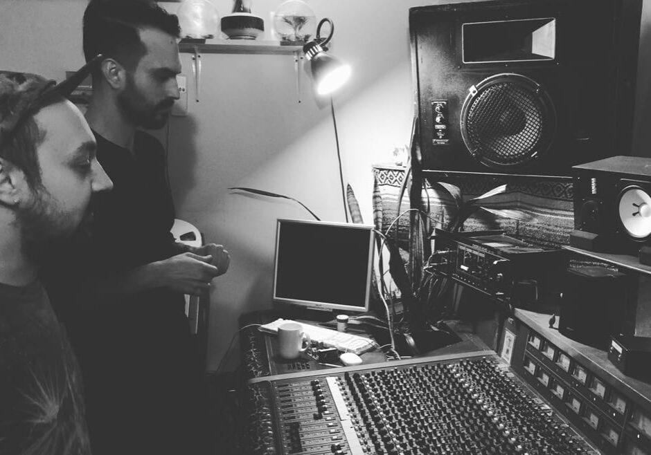 Musician and sound engineer at mixing board