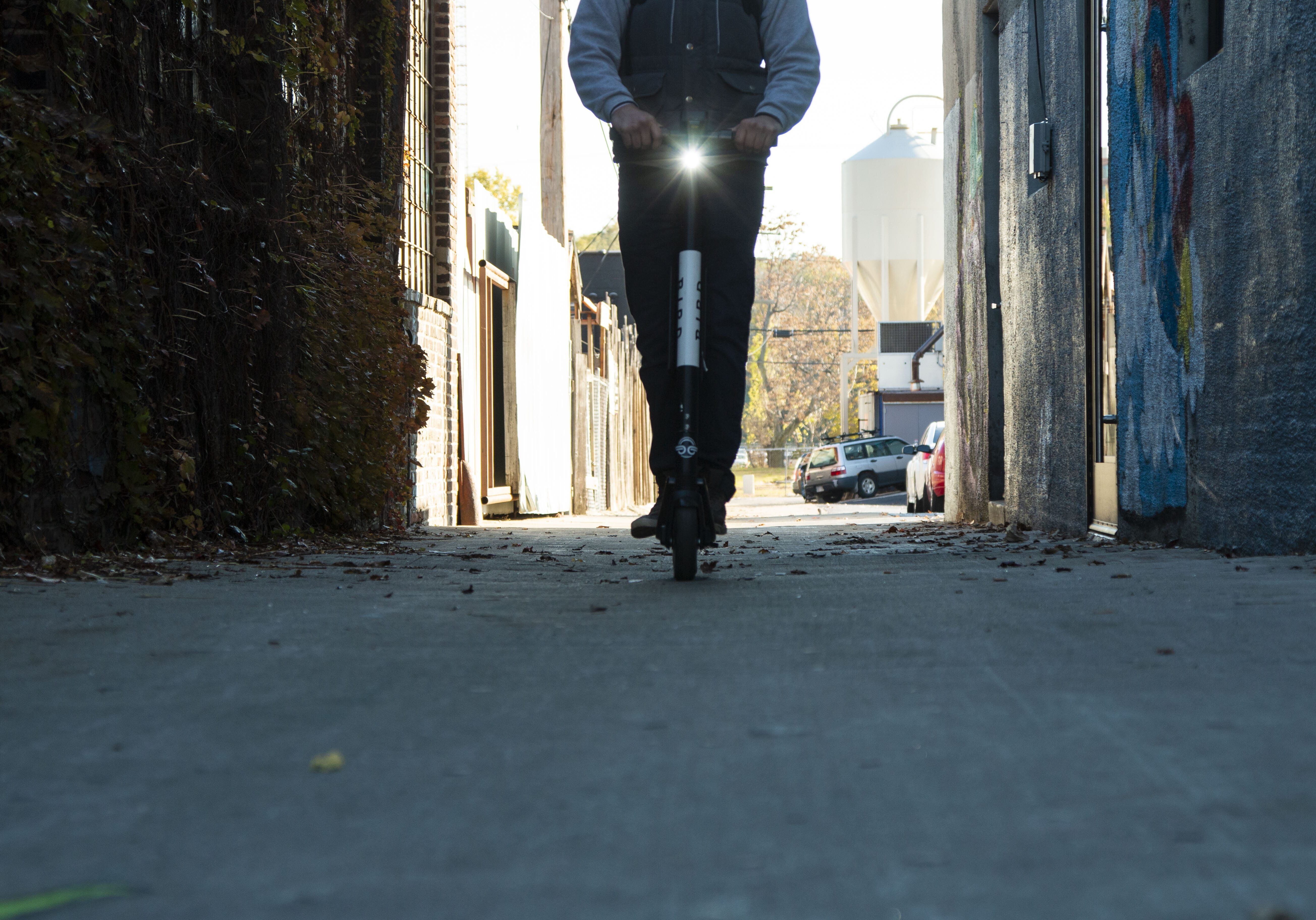 man riding a Bird scooter