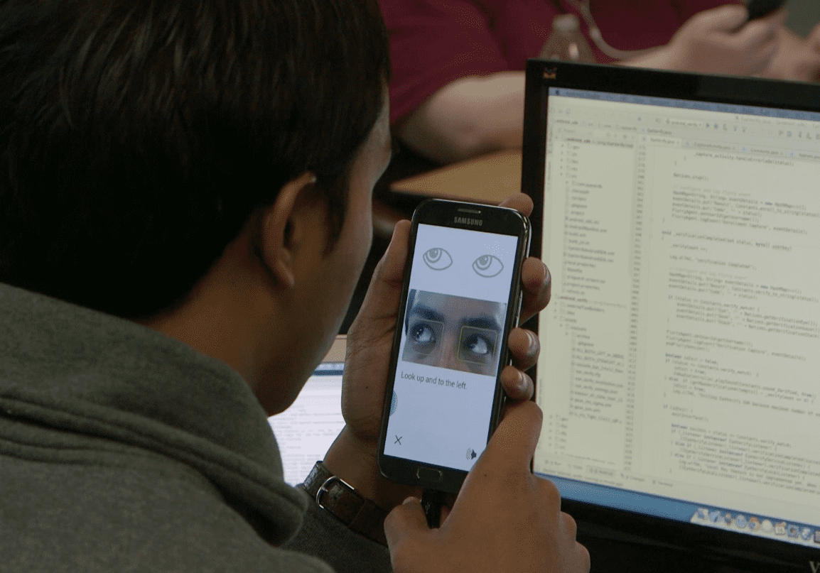 EyeVerify employee testing the app