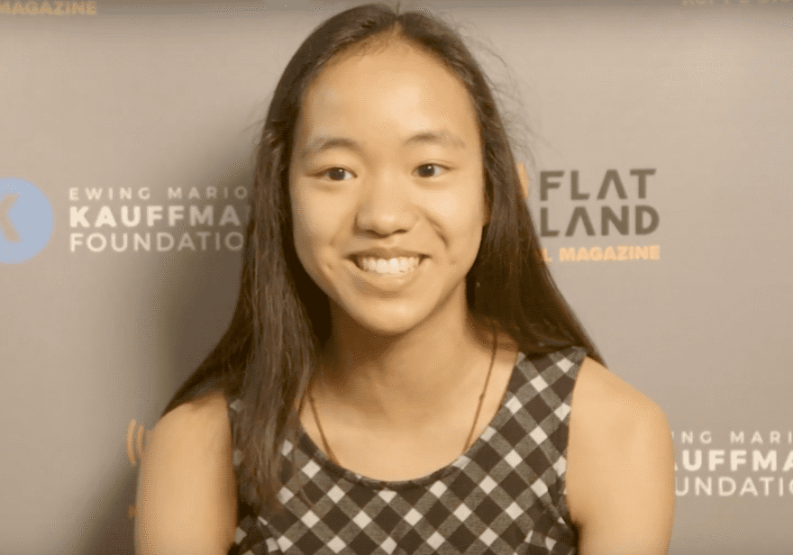 A young girl speaking on screen