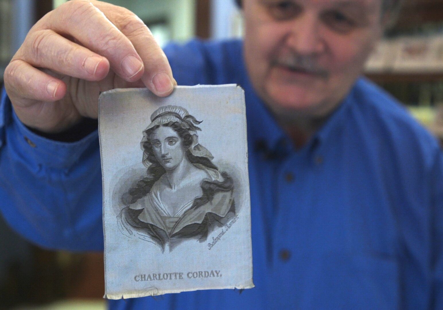 John Pottie has a story for each of the pieces in The National Silk Art Museum. This piece depicts Charlotte Corday, a French journalist who was executed on the guillotine during the French Revolution.