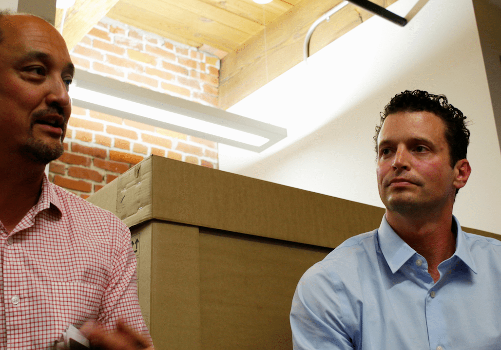 Herb Sih, managing partner & co-founder of Think Big Partners, and Isaiah Blackburn, Chief Strategist of Smart + Connected KC, at a "Smart City" panel Friday.