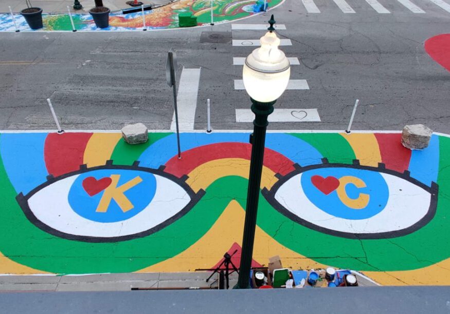 Aerial view of the “Eye Heart KC” mural by recent Kansas City Art Institute alumni Parker Story, at the intersection of Westport Road and Wyandotte Street, created as part of the first round of commissions under the Asphalt Art Initiative program.