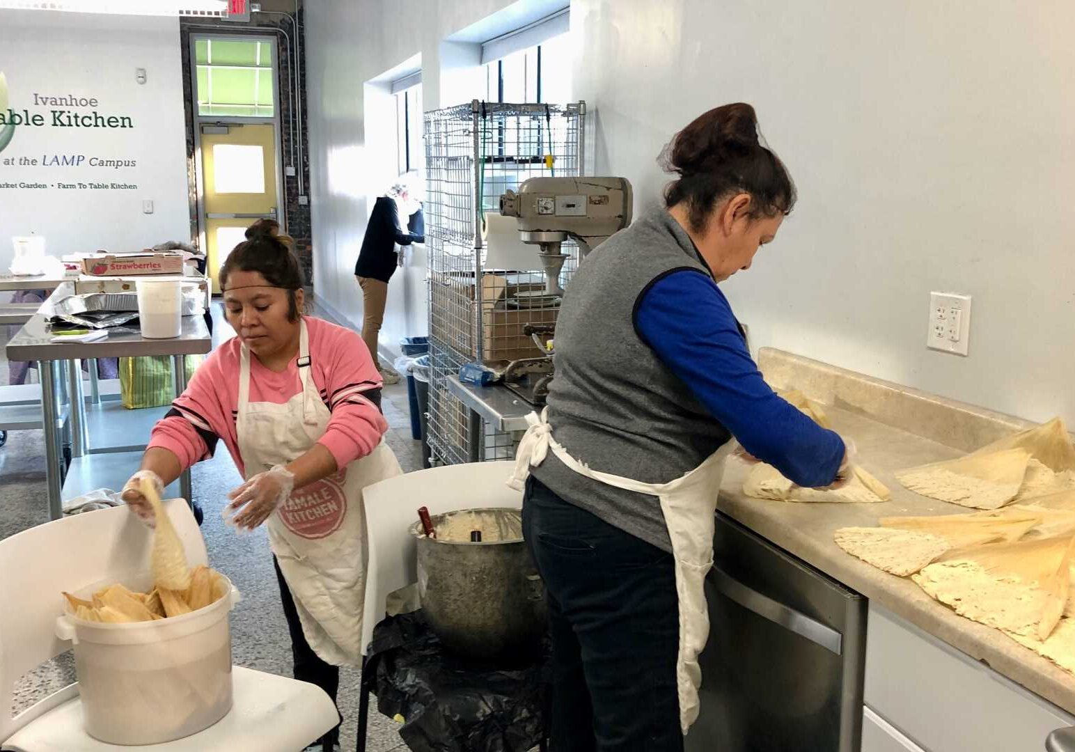 Lupe Quijano and Gigi Reyes, original members of The Tamale Kitchen, spend a Friday evening making tamales to supplement their family incomes. A new investor has set the stage for the next stage of the organization’s growth.