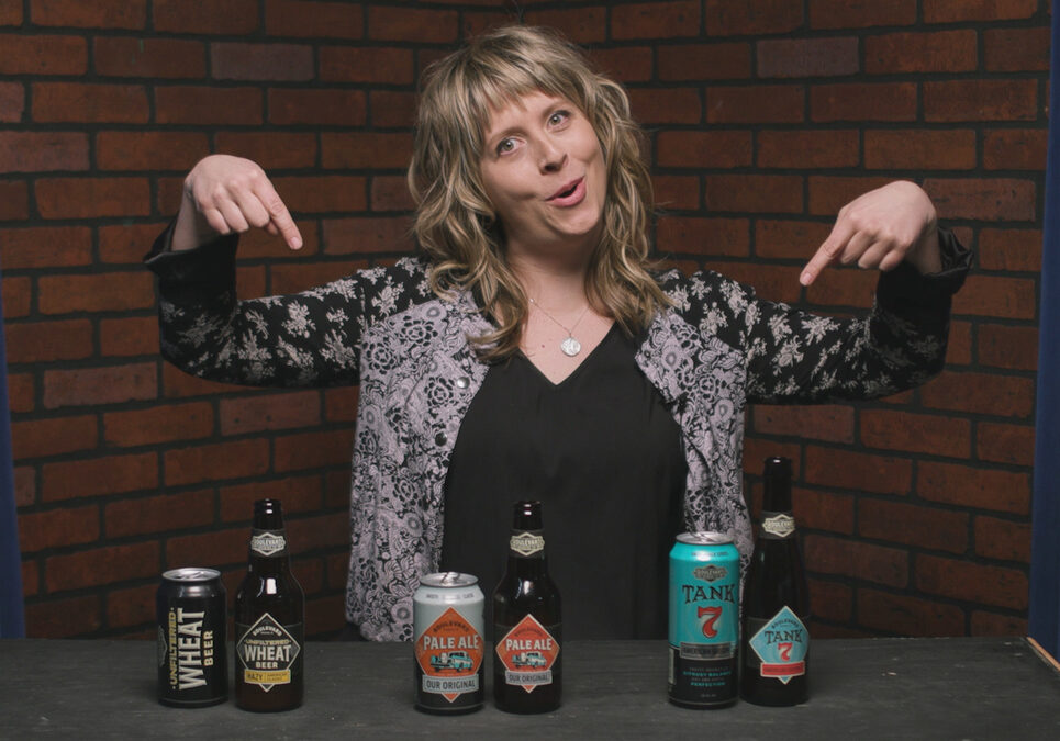Tap List's Cassie Niemeyer taste tests cans versus bottles. (Emily Woodring | Flatland)