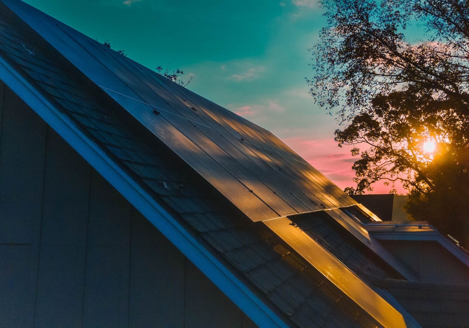 The morning light reflects off rooftop solar panels in the Lakewood subdivision.