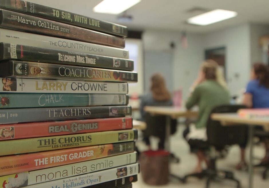Photo of stack of DVDs in a classroom.