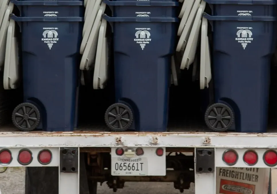 New Kansas City trash carts on a truck.