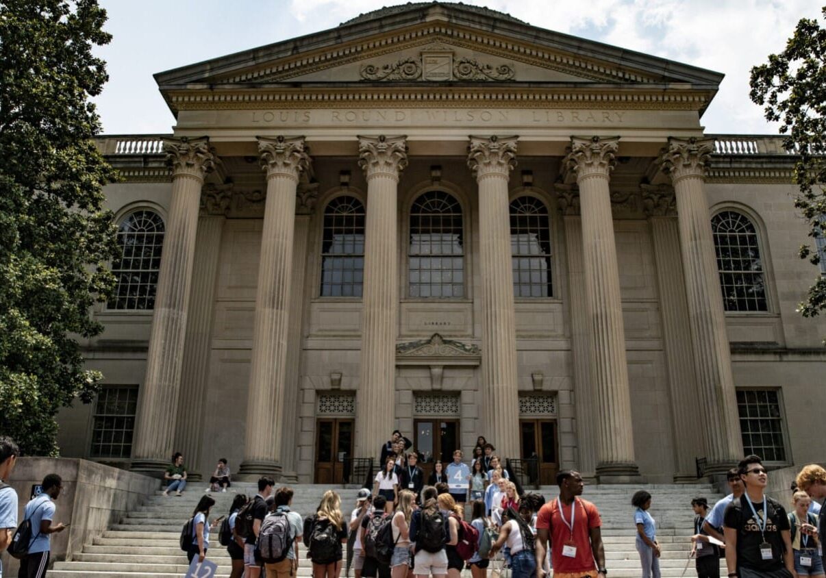 People walk on the campus of the University of North Carolina at Chapel Hill.