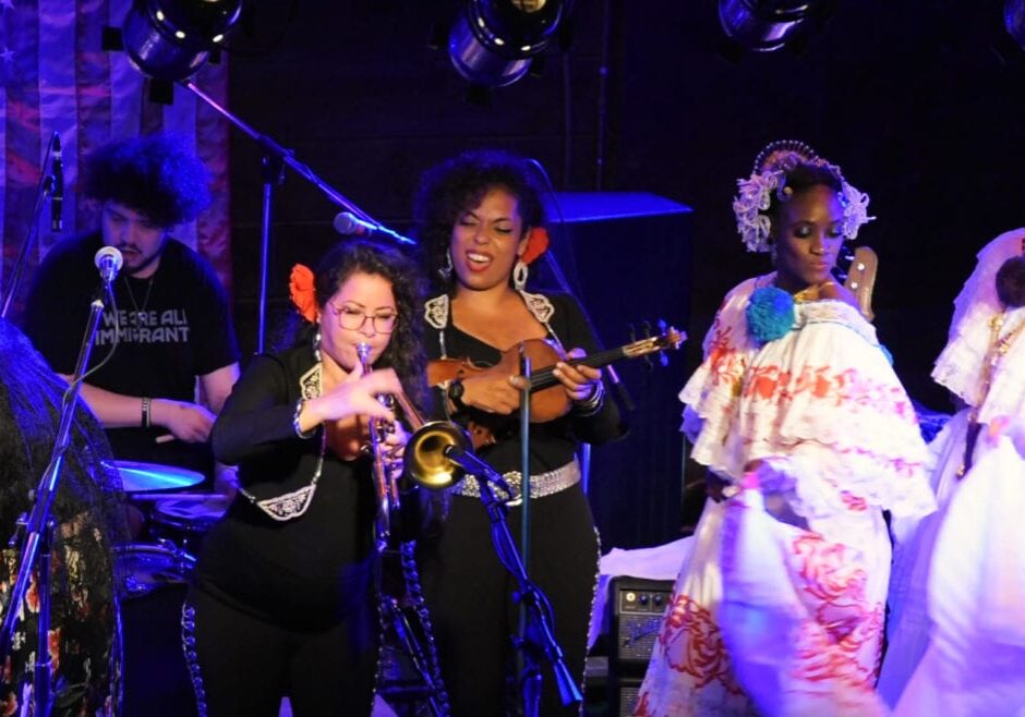 women singing and playing instruments