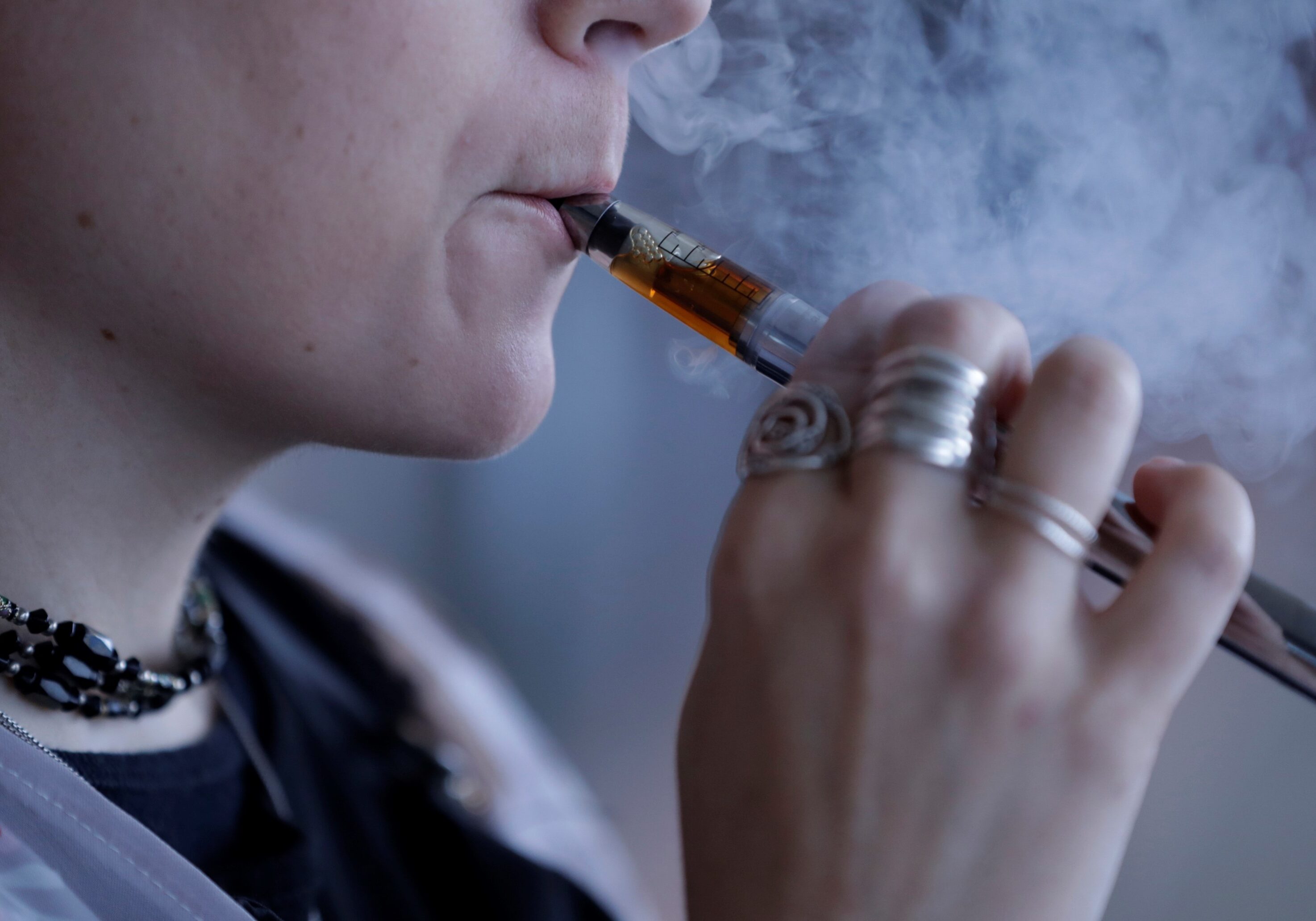 A woman using an electronic cigarette.