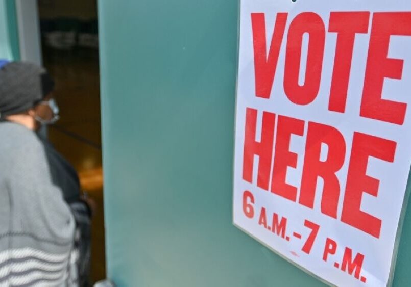 A voter enters the Brush Creek Community Center gym in Kansas City, Missouri, where a polling location was set up on Tuesday, April 4, 2023.