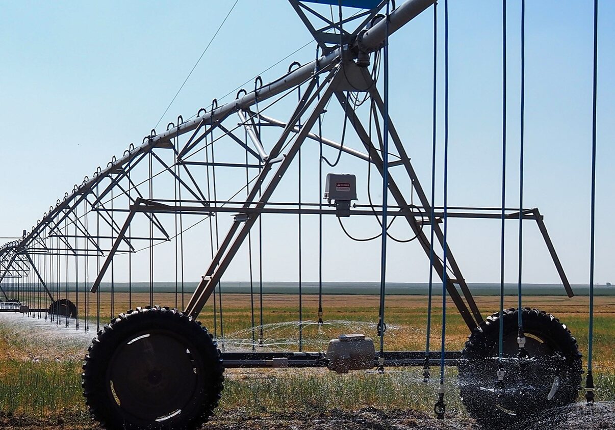 Sprinklers irrigate a field in Hamilton County, Kansas, where some farmers have petitioned to be removed from a local groundwater management district. State lawmakers are pressuring the district to do more to conserve water in the Ogallala Aquifer.