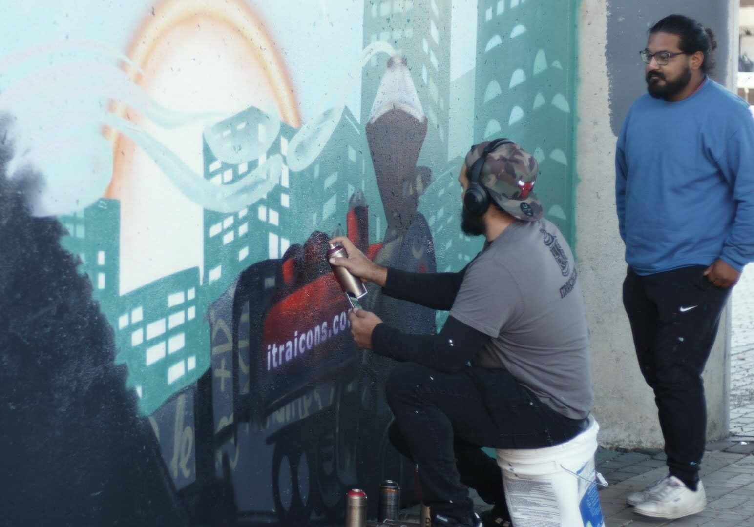 Isaac Tapia (right) and Rodrigo Alvarez are partners in ITRA, which has created more than 45 murals and other artworks in recent years.