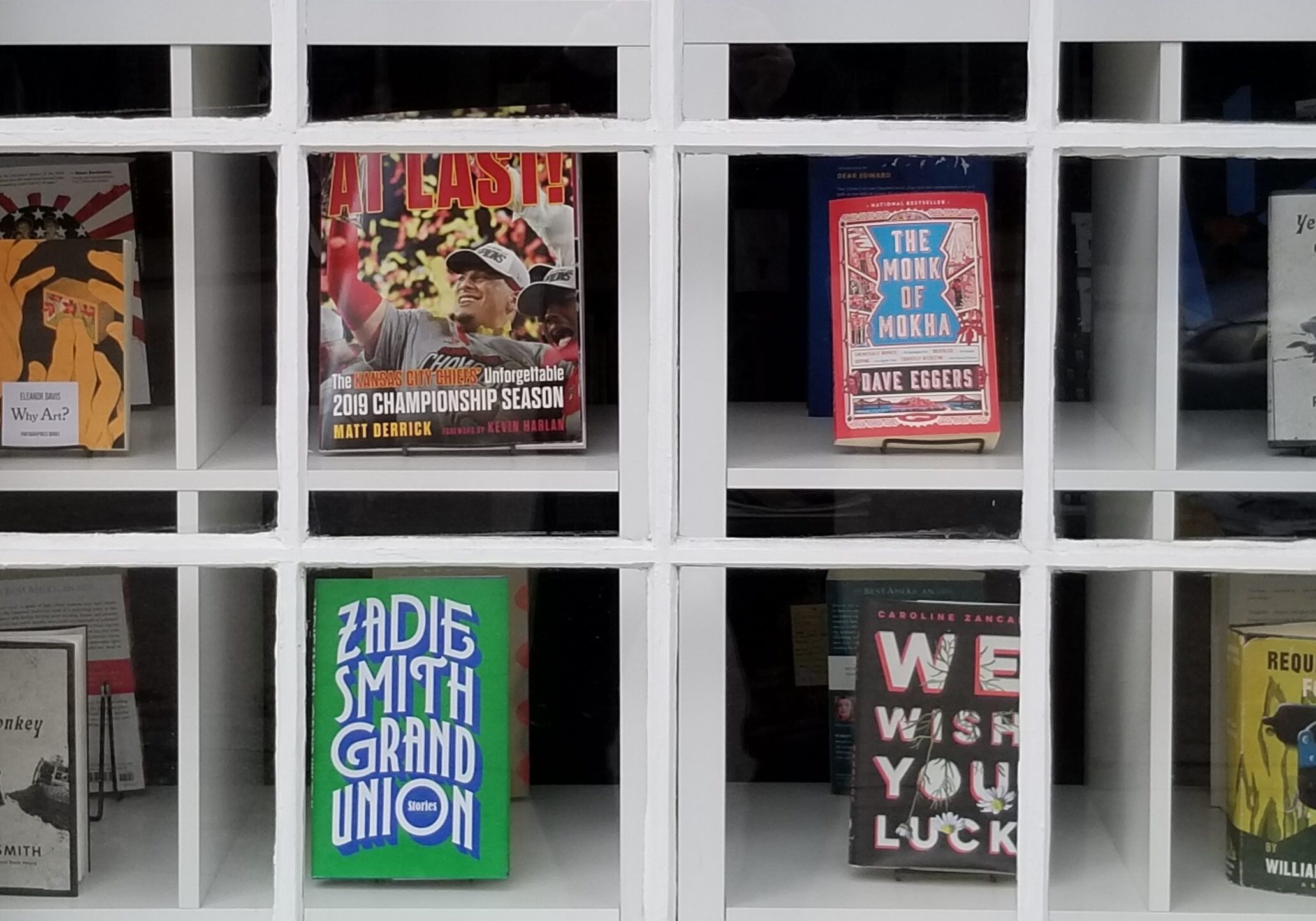 Books on display in the window of Wise Blood.