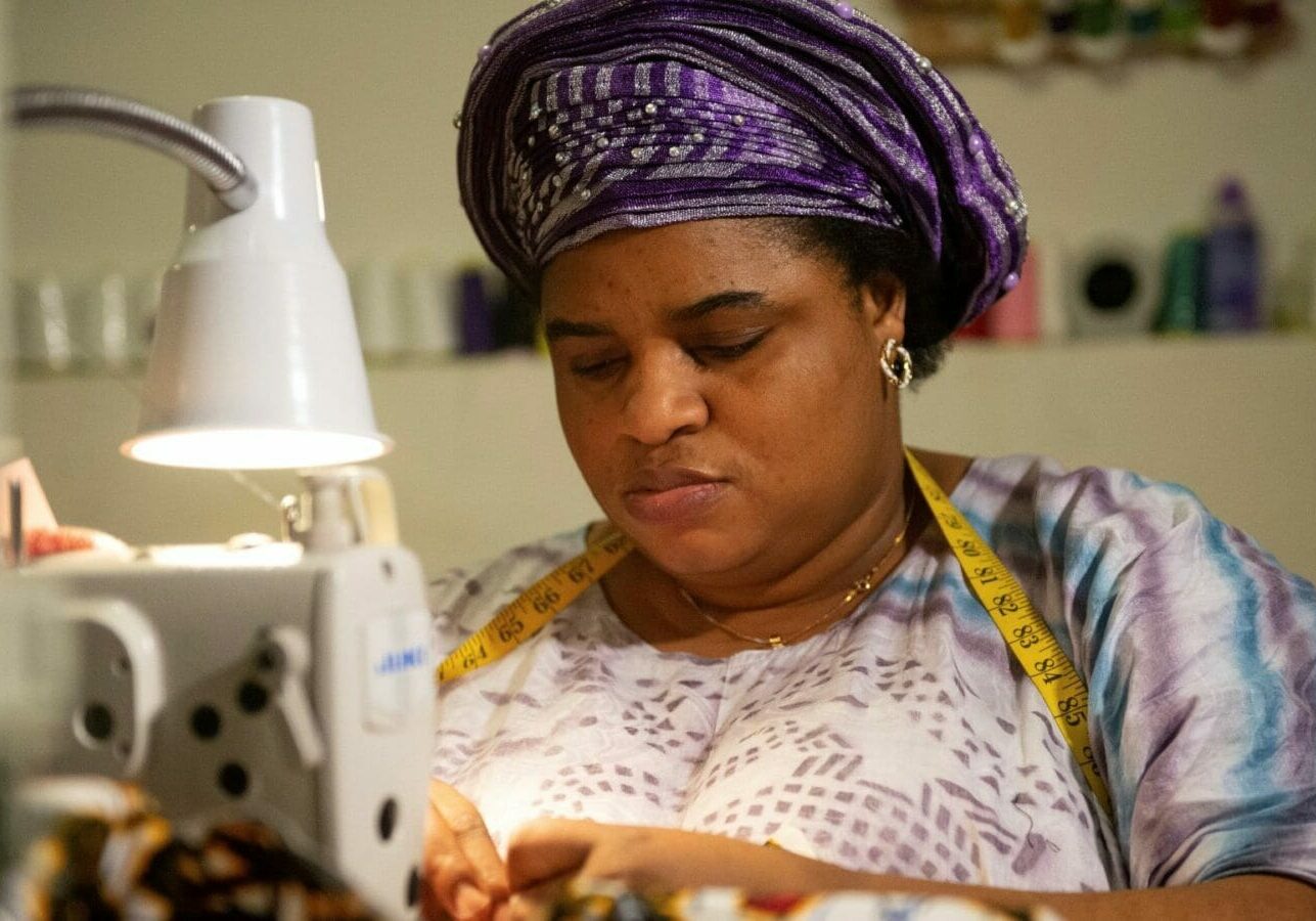 Liliane Lemani at work at her award-winning small sewing business.