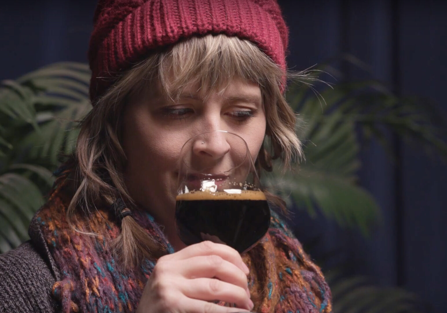 Beer enthusiast Cassie Niemeyer checks out a high alcohol content beer.