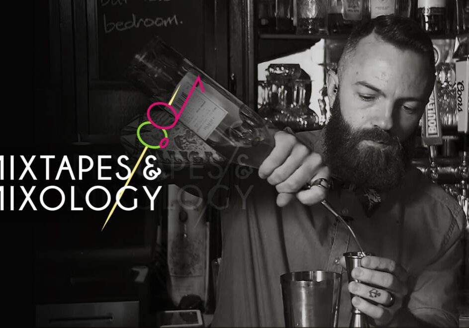 A bartender pouring a drink