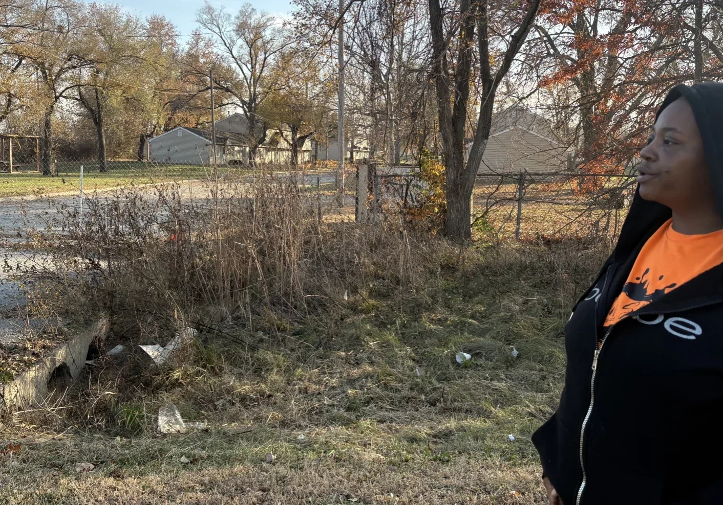 Candice Montgomery stands outside the closed Aspen Place apartment complex in Gardner, Kansas. She is one of hundreds of former residents who were kicked out of their homes when Gardner officials condemned the property. (Dylan Lysen | Kansas News Service