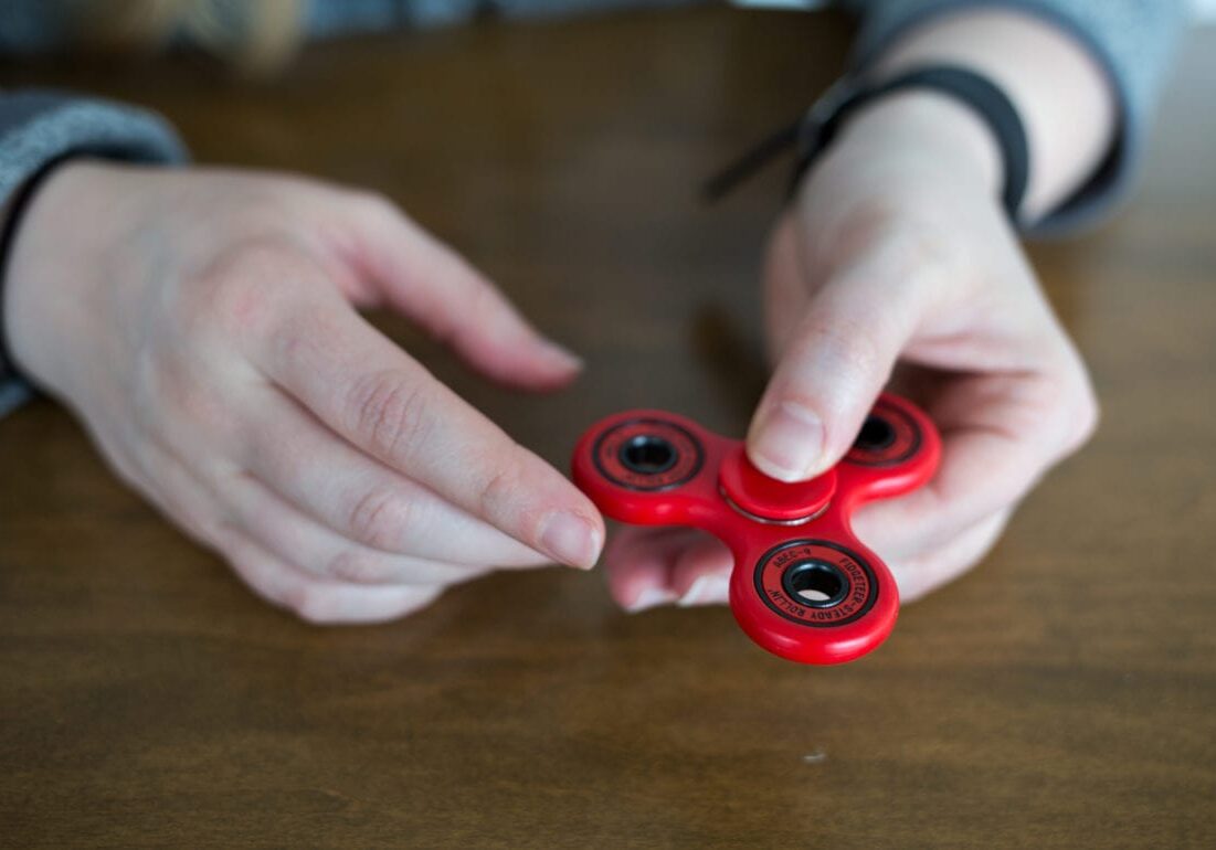 Fidget spinners come in different colors from a lot of different companies, but the basic one has three prongs centered around a circle with barrings in the middle. (Source: NPR |
Credit: Raquel Zaldivar)