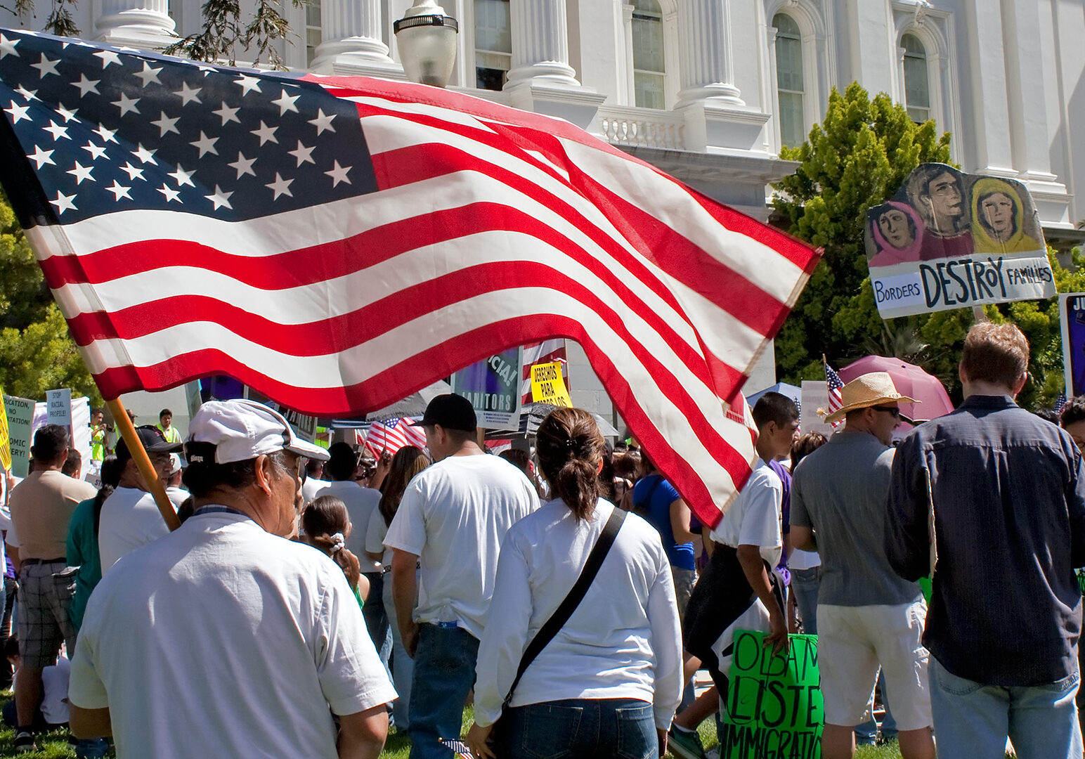 American flag held by man