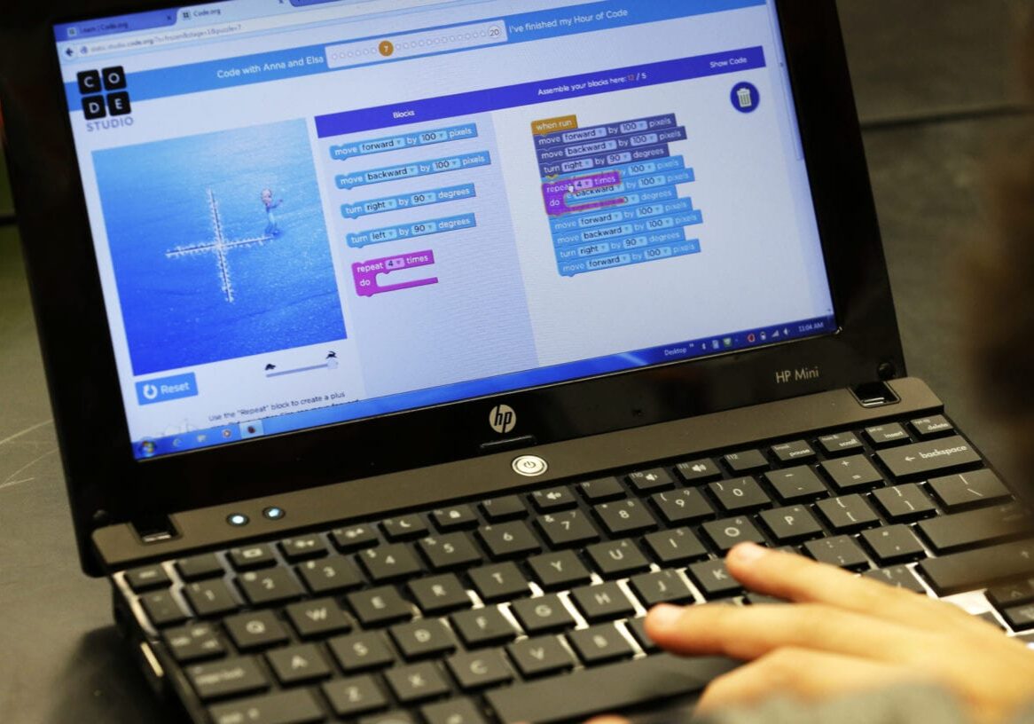 A student at Pacific Middle School in Des Moines, Wash., writes computer code as part of the international Hour of Code project, Tuesday, Dec. 9, 2014. The project seeks to increase interest and education in computer science by exposing students to an hour or more of simple computer programing. (AP Photo/Ted S. Warren)