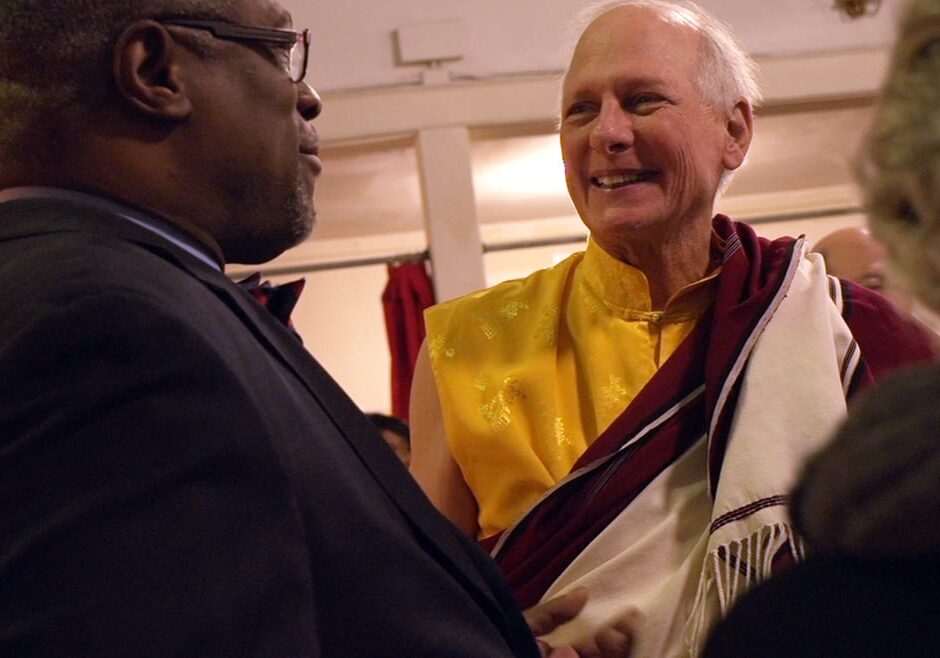 Mayor Sly James and Lama Chuck Stanford connect at Stanford's retirement celebration in December 2015. Kansas City faiths came together that day, as they will today, on the fourth day of SevenDays. (Photo: Flatland)