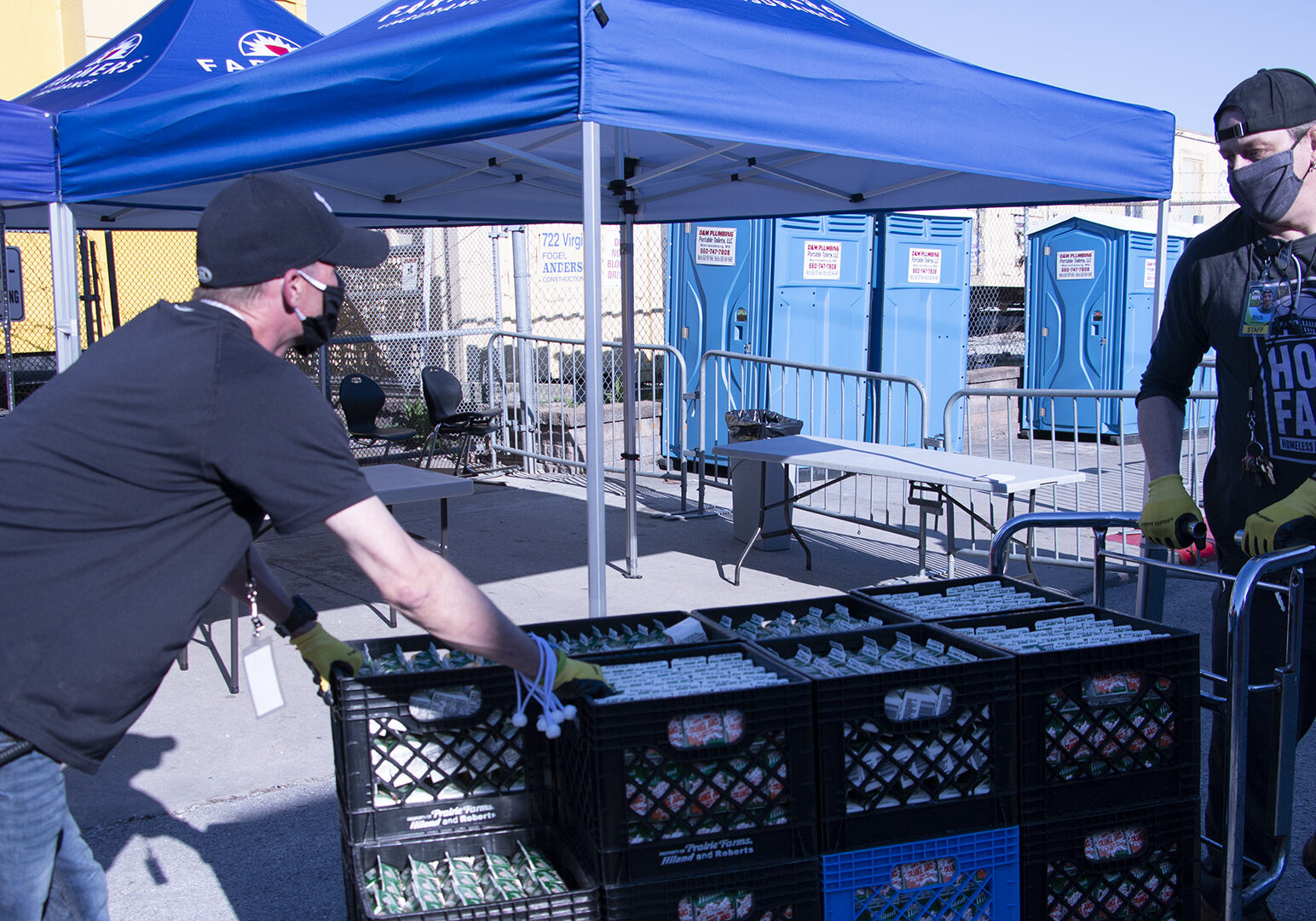 two hope faith staffers wheel in some donated orange juice