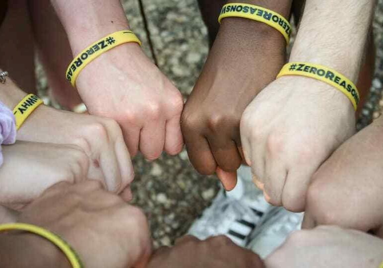 Supporters wearing Zero Reasons Why wrist bands.