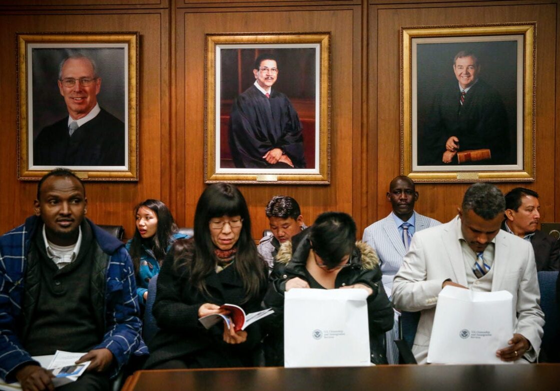 In 2017, hundreds of thousands of immigrants are expected to be naturalized as U.S. citizens in ceremonies around the country, much like this one in Kansas City, Mo.