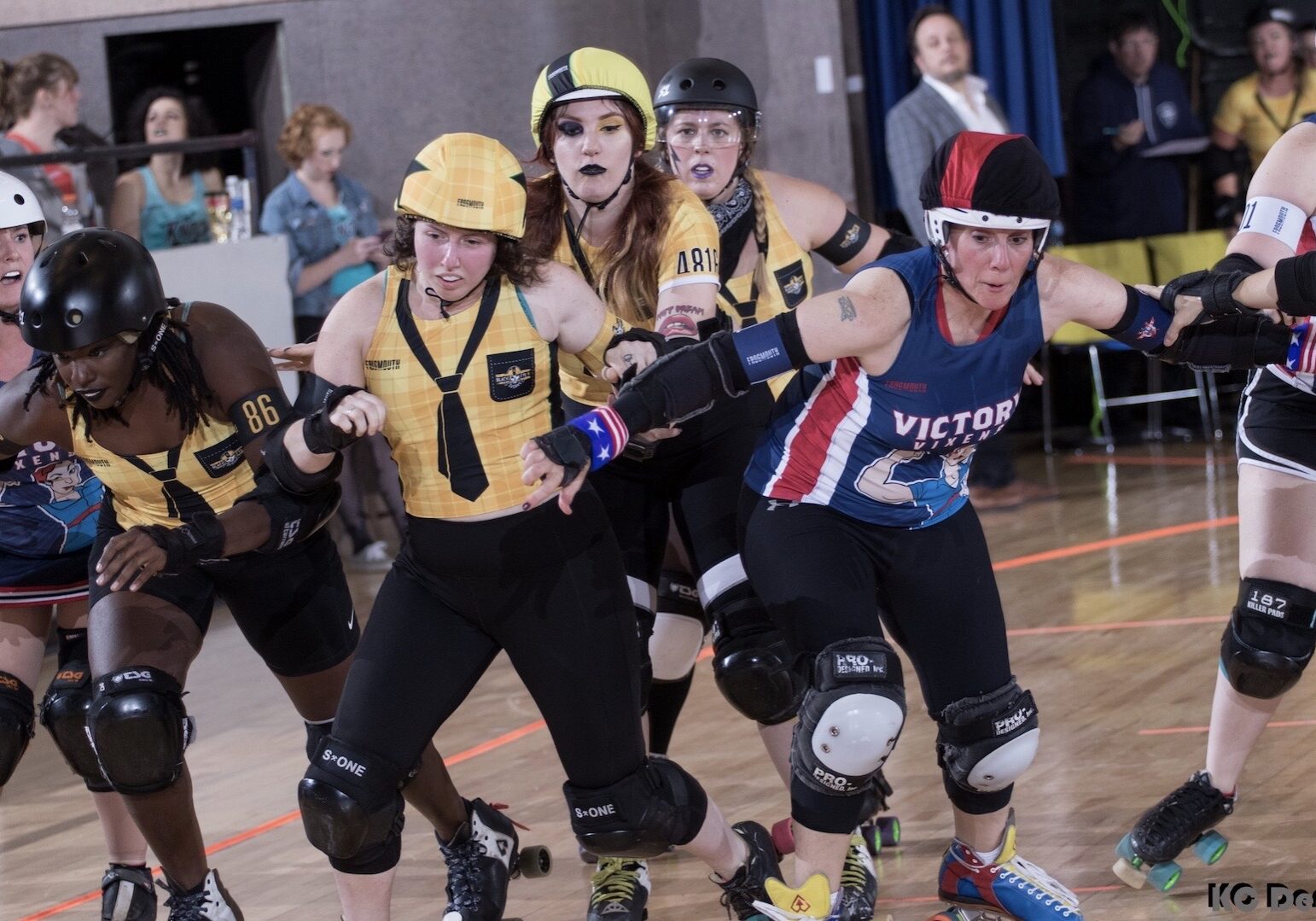 A pack of skater shove their way toward the camera.
