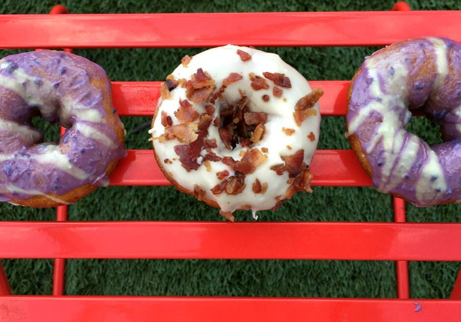 three colorful donuts on a table