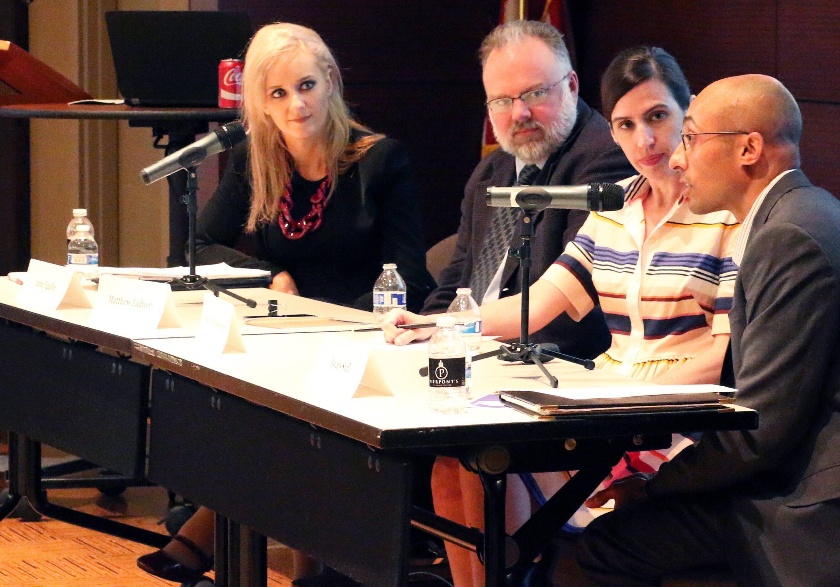 Awais Sufi (right), president and CEO of School Smart KC, moderates a panel discussion during the “Eye on Education: Failures to Fixes” conference held Monday at the Kansas City Public Library's Central Branch. Panelists were (from left) Anna Egalite of North Carolina State University, Matthew Ladner of the Charles Koch Institute, and Megan Tompkins-Stange of the University of Michigan. (Kelly Cordingley | Flatland)