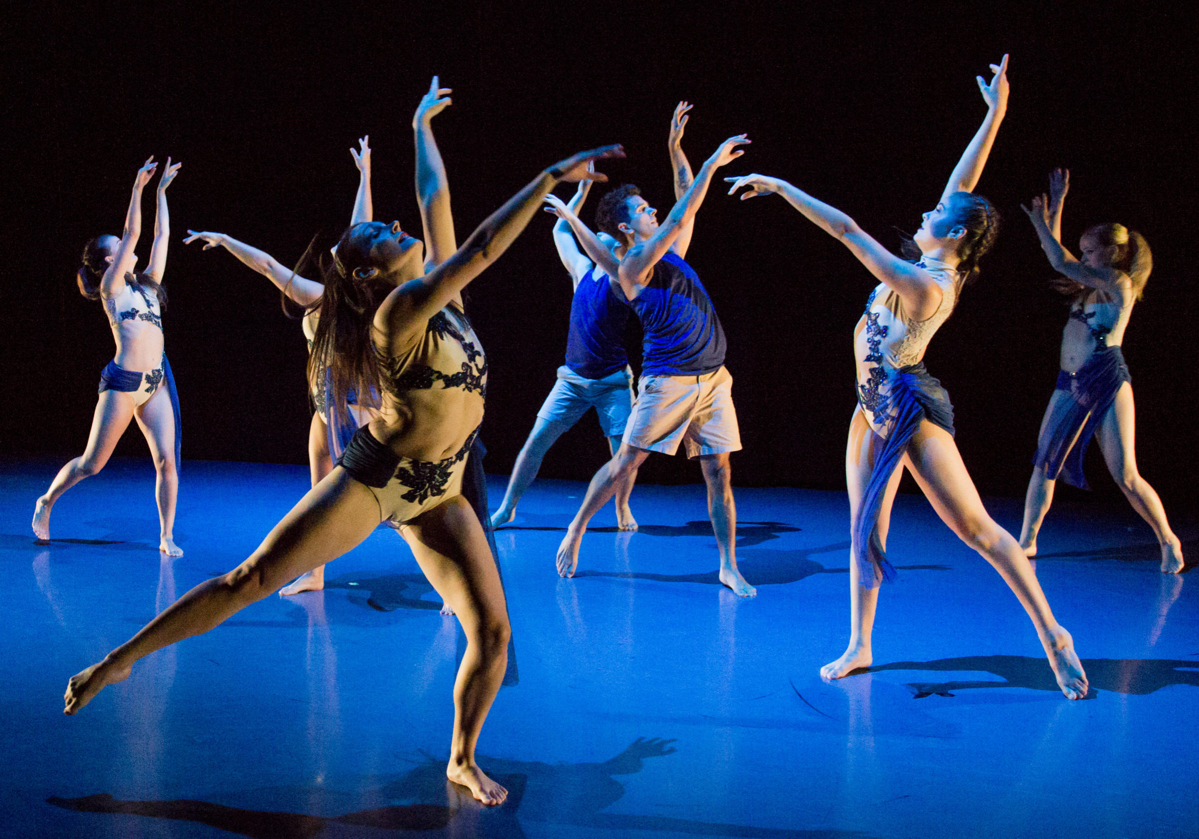Dancers perform on stage.