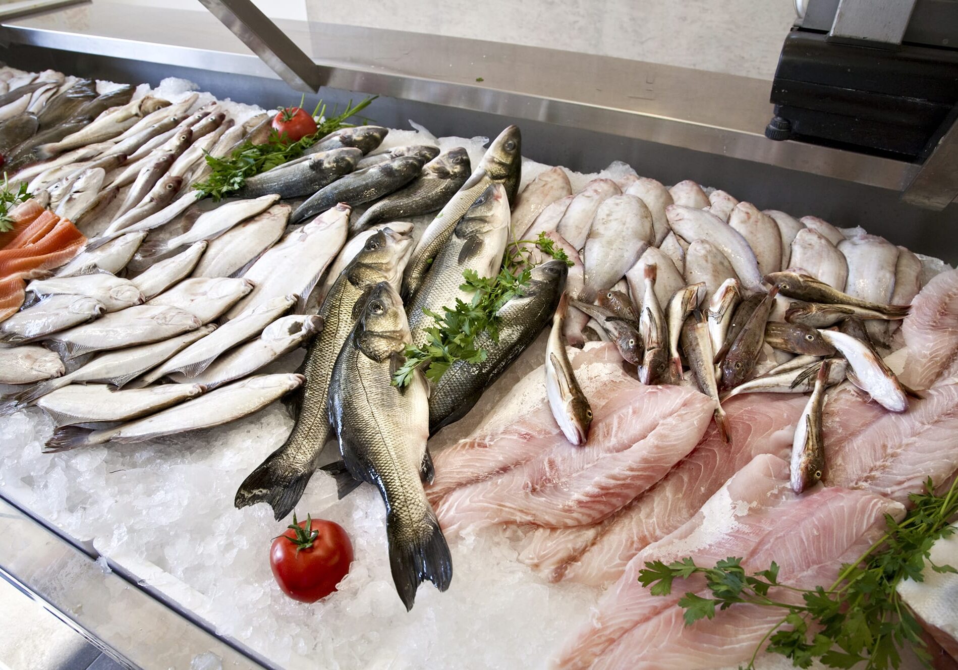 Raw fresh fish for sale at a supermarket. Using seafood guides to decide which fish is the most environmentally choice can be difficult when different guides make slightly different recommendations