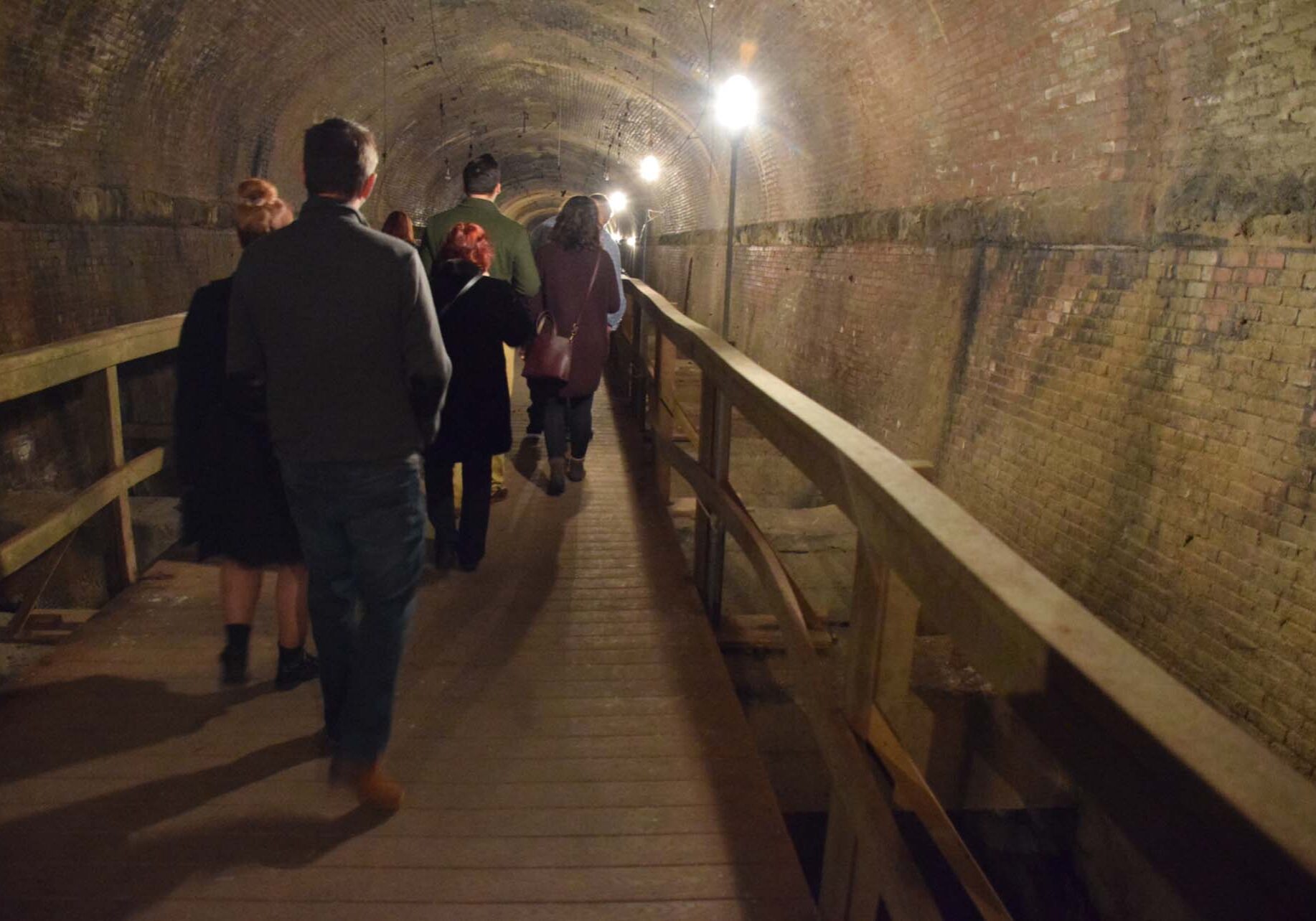 a tour group in the eighth street tunnel