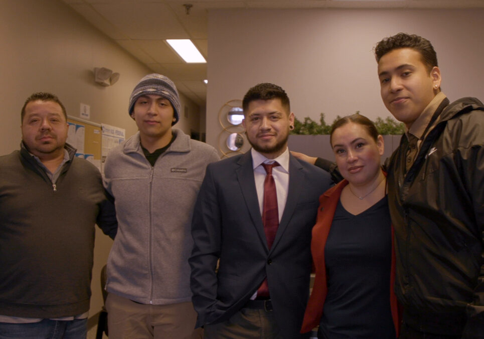 Group of men and woman standing together