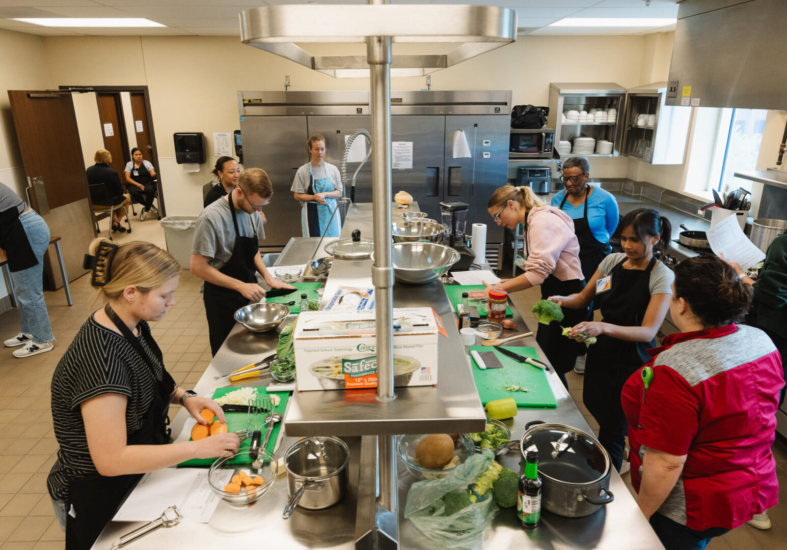 KU Med students prepare ingredients in a culinary medicine class where they learn about nutrition and food as medicine as well as how to cook a selection of dishes. They critique the meals as well as talk about how it can benefit their patients. (Chase Castor | Flatland)