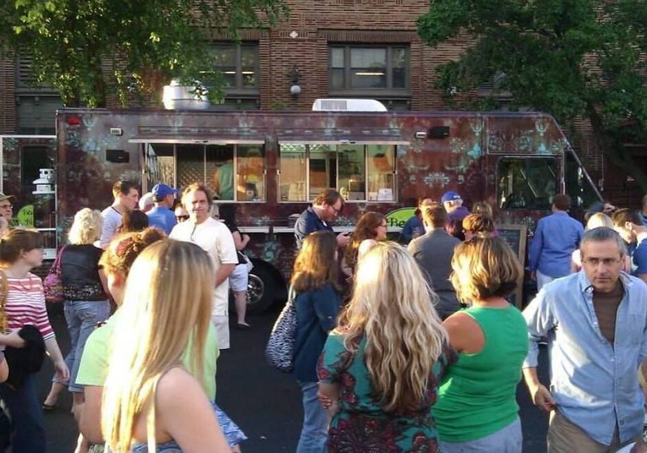 A food truck and a hungry crowd.