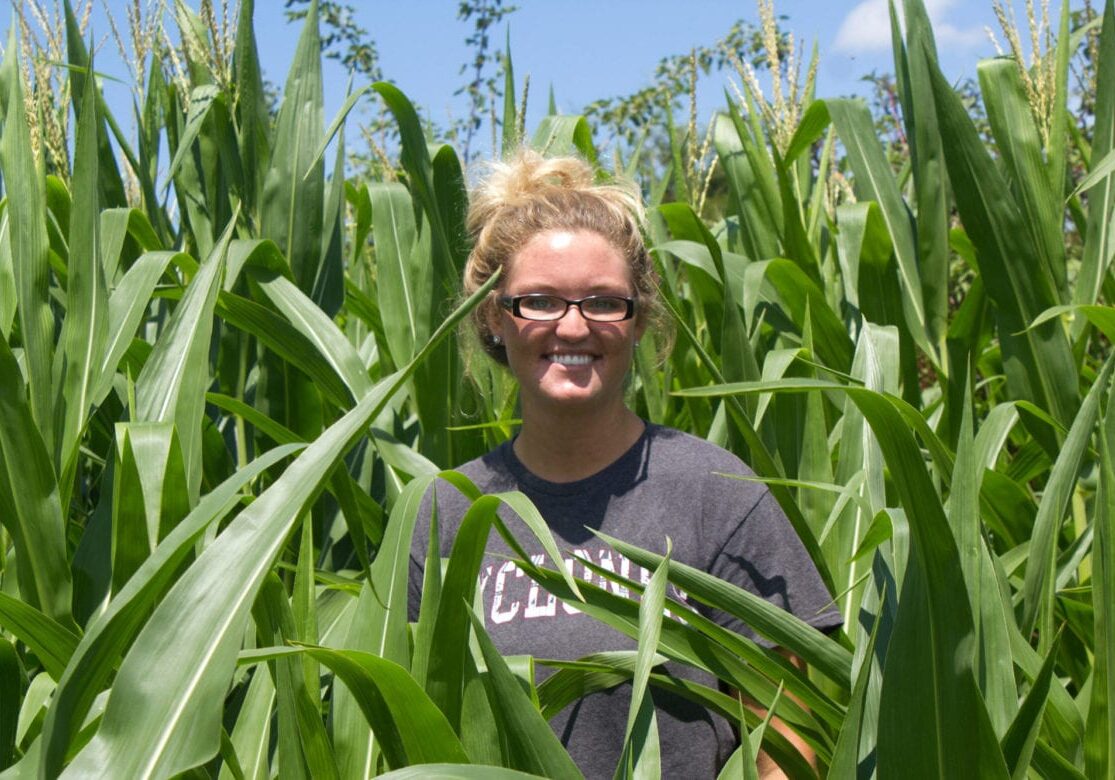 A woman standing in a field.