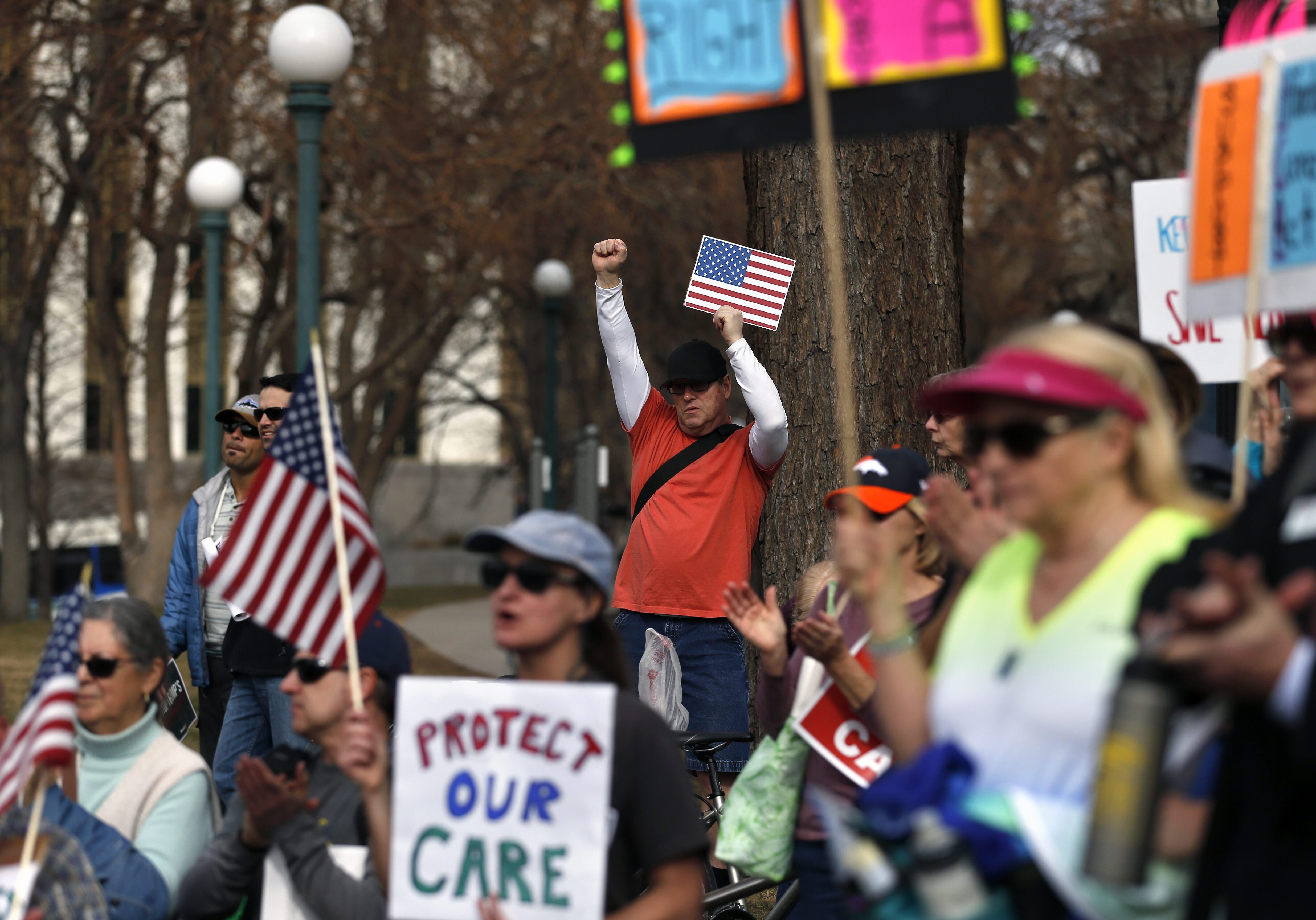 Supporters of the Affordable Care Act who are also opponents of Colorado's GOP-led plan to undo Colorado's state-run insurance exchange gather for a rally organized by the national Save My Care Bus Tour, on the state Capitol steps in Denver, Tuesday, Feb. 7, 2017. A bill being heard in the Senate Finance Committee would abolish the state-run health insurance exchange. (AP Photo/Brennan Linsley)