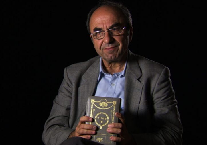 Rexhep Hoxha from 'Besa: The Promise.' holding Hebrew prayerbook