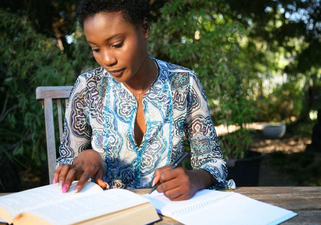 Woman working on papers at table