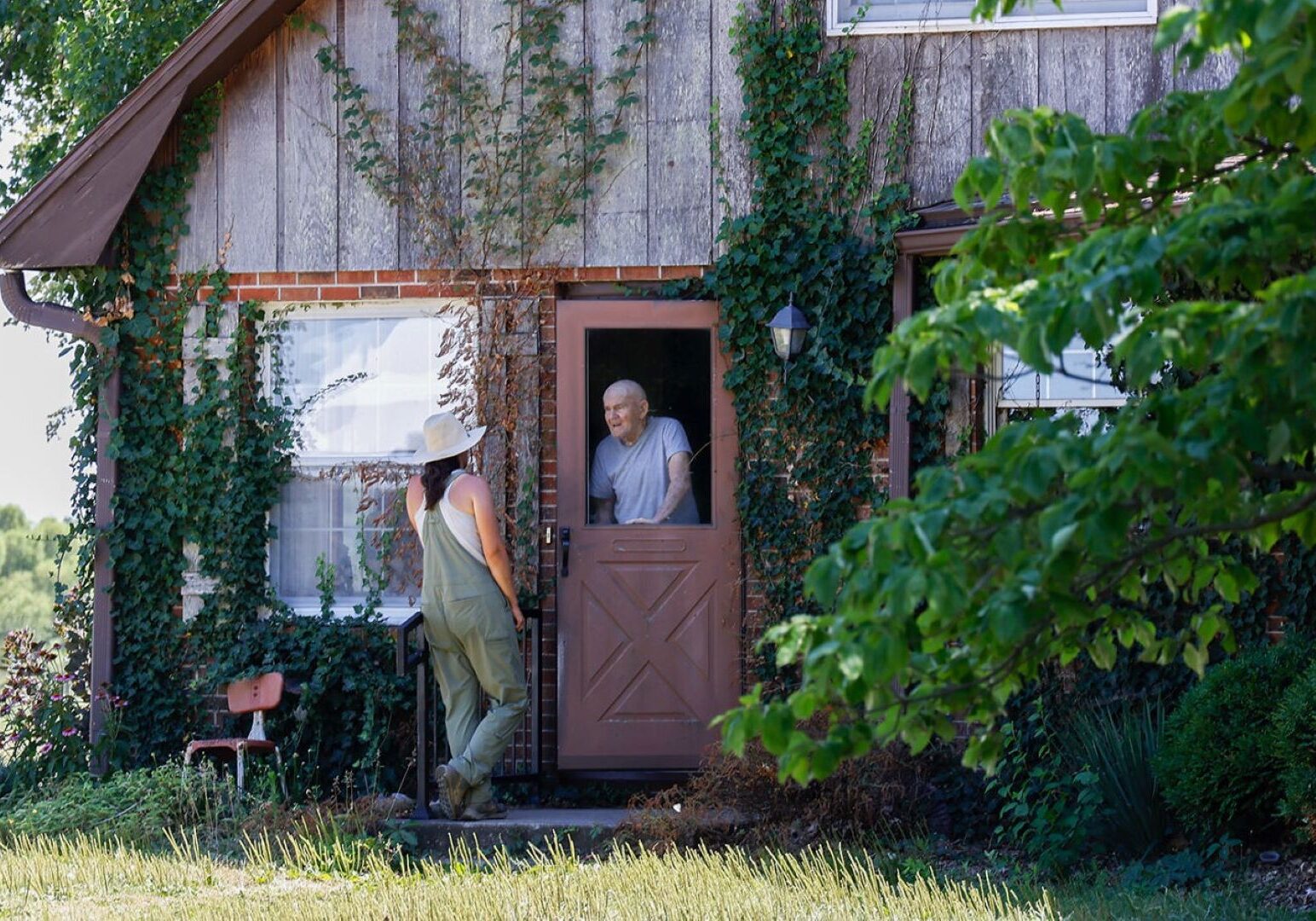 Jordan Welch talks to her grandfather Charlie Payne on July 20 in Concordia.
