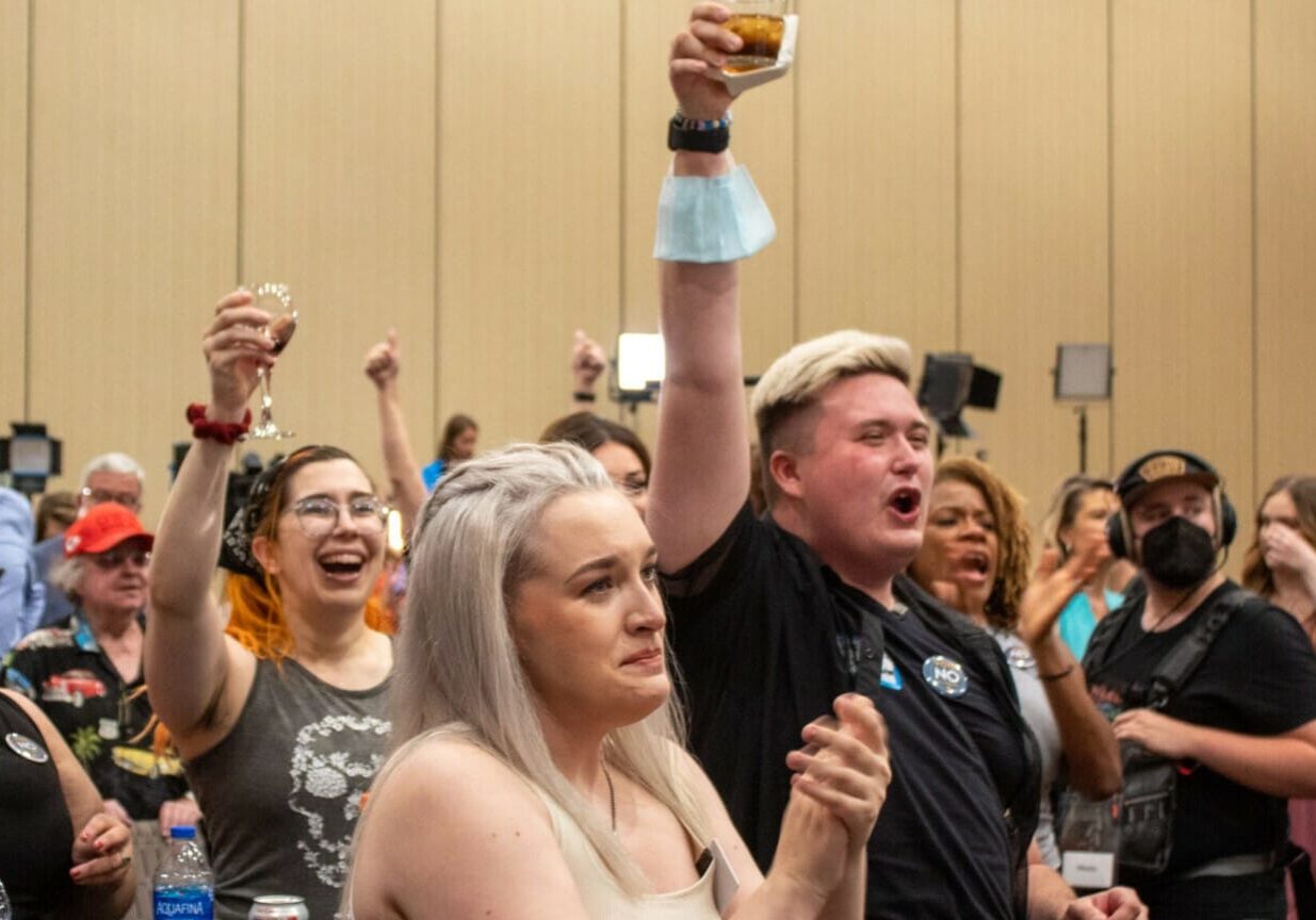 Attendees of the Kansans for Constitutional Freedom watch party celebrate after primary election results verify Kansans voted to keep abortion a constitutional right.